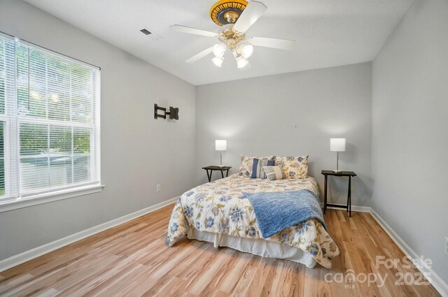 317 Cedarcroft Dr, Mooresville, NC 28115 - bedroom with wood finished floors, baseboards, and a ceiling fan