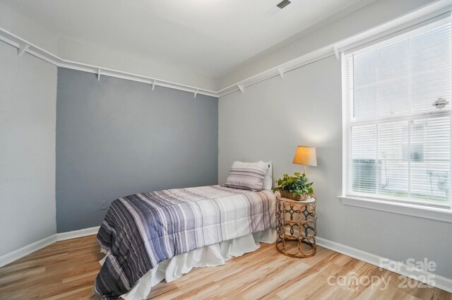 317 Cedarcroft Dr, Mooresville, NC 28115 - bedroom with wood finished floors and baseboards