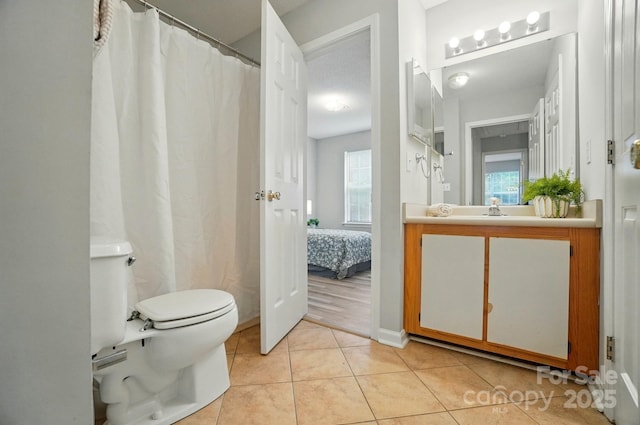317 Cedarcroft Dr, Mooresville, NC 28115 - ensuite bathroom with vanity, toilet, and tile patterned flooring