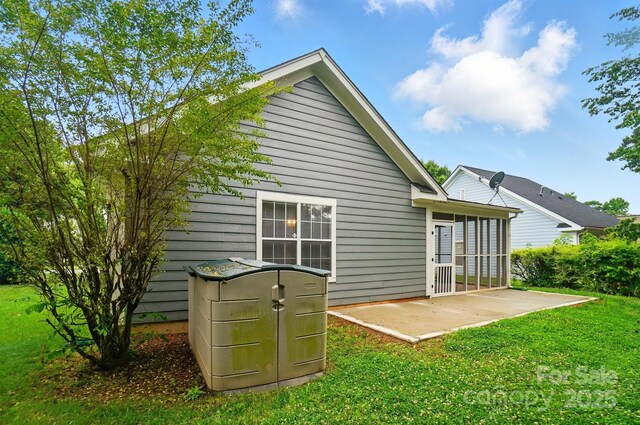 317 Cedarcroft Dr, Mooresville, NC 28115 - rear view of property featuring a patio and a lawn