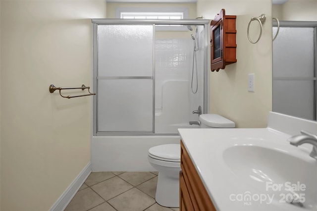 814 Settlers Dr, Cherryville, NC 28021 - bathroom featuring tile patterned floors, toilet, combined bath / shower with glass door, vanity, and baseboards