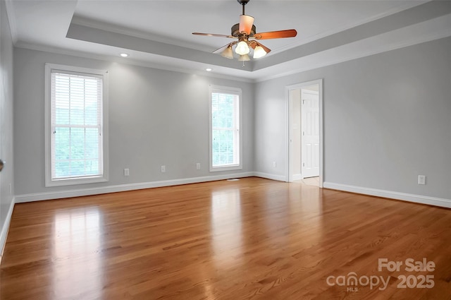814 Settlers Dr, Cherryville, NC 28021 - unfurnished room featuring a raised ceiling, crown molding, baseboards, a ceiling fan, and light wood finished floors