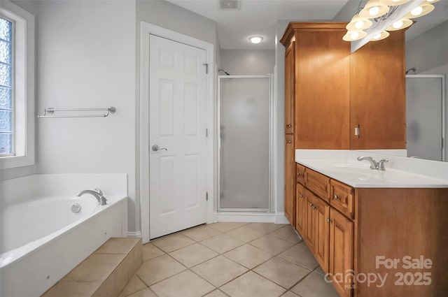 814 Settlers Dr, Cherryville, NC 28021 - full bath featuring vanity, a stall shower, tile patterned flooring, and a garden tub