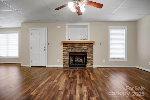 814 Settlers Dr, Cherryville, NC 28021 - unfurnished living room featuring a drop ceiling, wood finished floors, a fireplace, ceiling fan, and baseboards