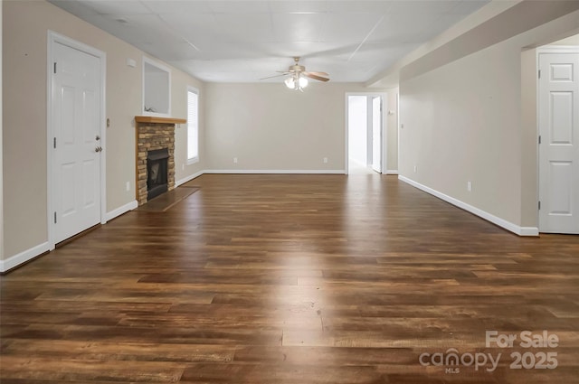 814 Settlers Dr, Cherryville, NC 28021 - unfurnished living room featuring ceiling fan, dark wood-style floors, a fireplace, and baseboards