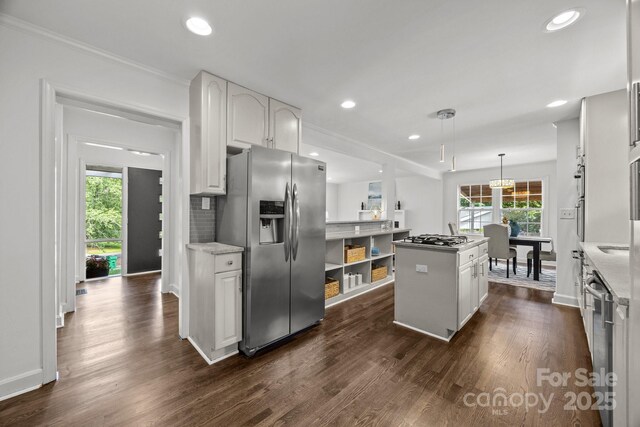 917 Dent Ct, Charlotte, NC 28210 - kitchen featuring stainless steel appliances, a center island, dark wood-type flooring, recessed lighting, and crown molding