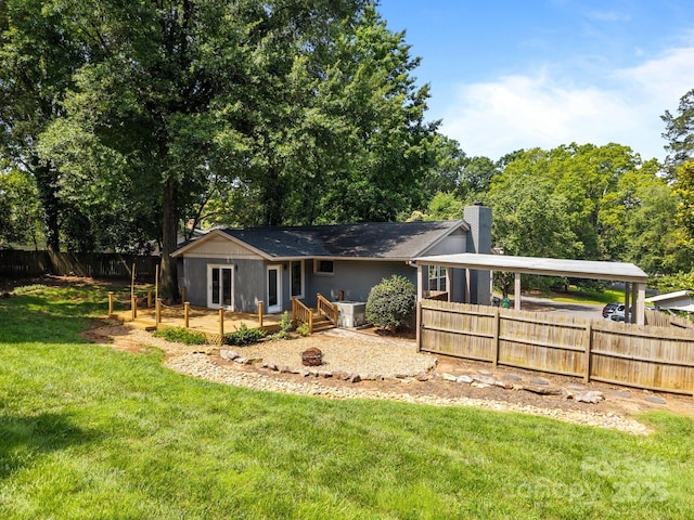 917 Dent Ct, Charlotte, NC 28210 - rear view of house with a chimney and a carport