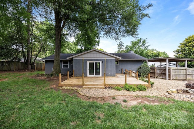 917 Dent Ct, Charlotte, NC 28210 - rear view of house with a wooden deck, a fenced backyard, and a chimney