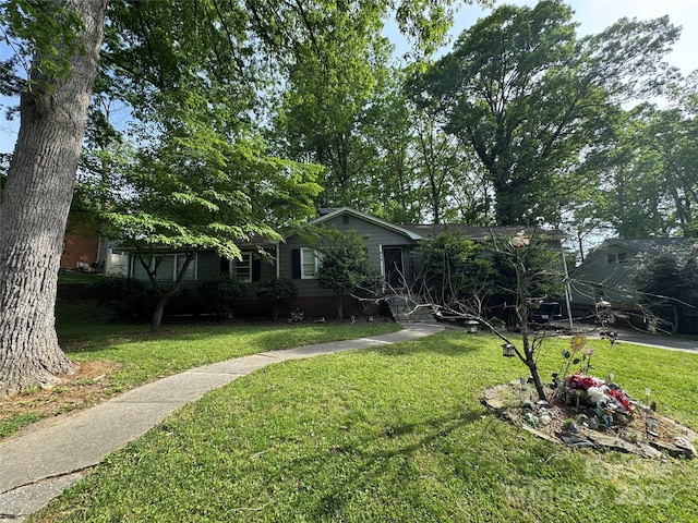 view of front of home with a front lawn