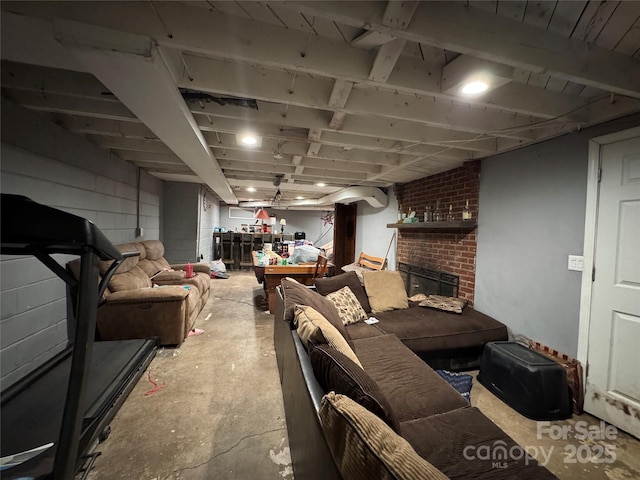 finished below grade area featuring a fireplace