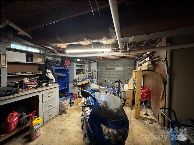 unfinished basement featuring a workshop area