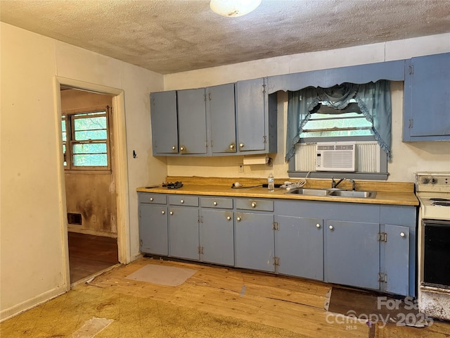 112 Greenwood Ave, Belmont, NC 28012 - kitchen featuring electric range, gray cabinets, a sink, cooling unit, and a textured ceiling