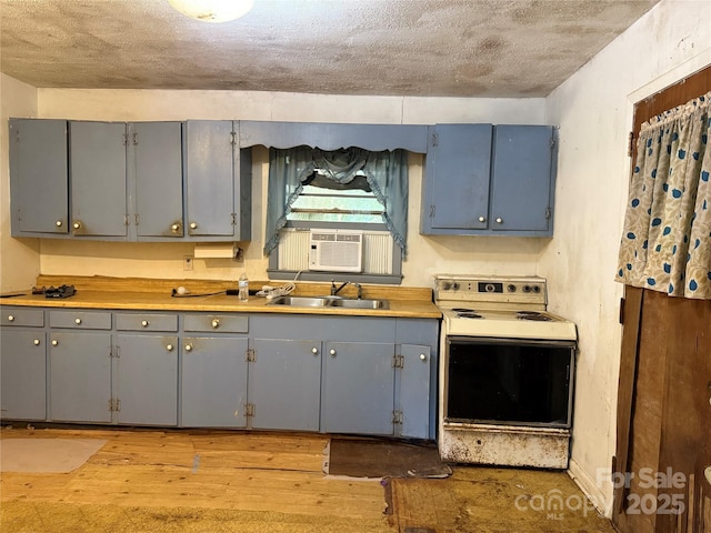 112 Greenwood Ave, Belmont, NC 28012 - kitchen with white range with electric cooktop, a sink, gray cabinets, light wood-style flooring, and a textured ceiling