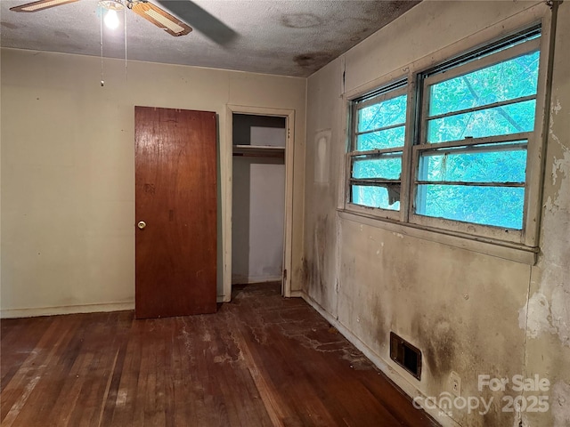 112 Greenwood Ave, Belmont, NC 28012 - unfurnished bedroom featuring hardwood / wood-style flooring, a textured ceiling, baseboards, and ceiling fan