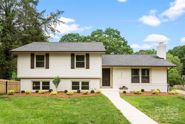 3661 Annlin Ave, Charlotte, NC 28209 - split level home featuring brick siding, a chimney, and a shingled roof