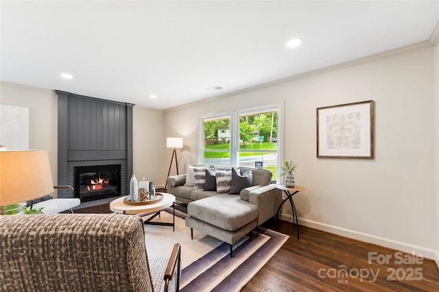 3661 Annlin Ave, Charlotte, NC 28209 - living area with dark wood-type flooring, ornamental molding, baseboards, a fireplace, and recessed lighting
