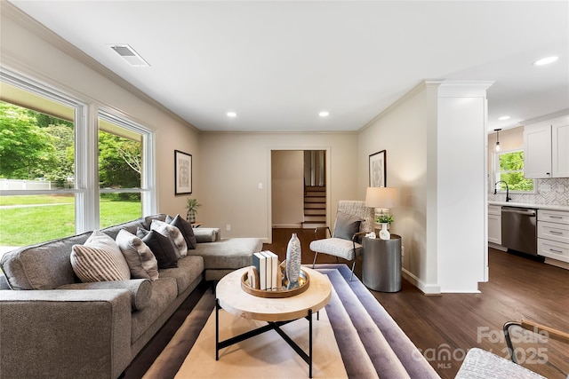3661 Annlin Ave, Charlotte, NC 28209 - living area with dark wood finished floors, crown molding, recessed lighting, and baseboards