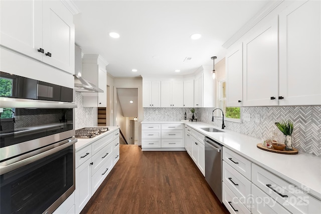 3661 Annlin Ave, Charlotte, NC 28209 - kitchen featuring a sink, appliances with stainless steel finishes, decorative backsplash, white cabinets, and recessed lighting