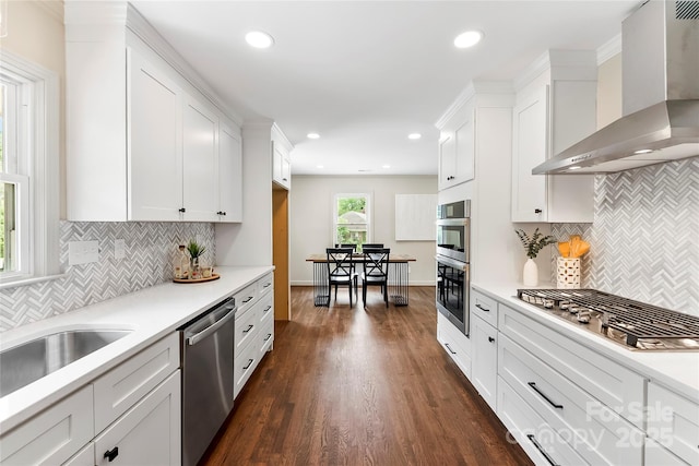 3661 Annlin Ave, Charlotte, NC 28209 - kitchen featuring wall chimney exhaust hood, stainless steel appliances, backsplash, light countertops, and recessed lighting