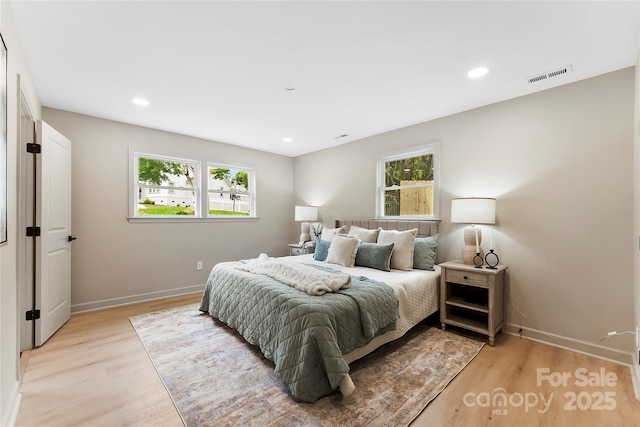 3661 Annlin Ave, Charlotte, NC 28209 - bedroom featuring multiple windows, light wood finished floors, baseboards, and recessed lighting