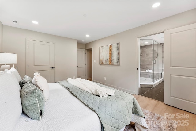 3661 Annlin Ave, Charlotte, NC 28209 - bedroom with wood finished floors, recessed lighting, baseboards, and ensuite bathroom