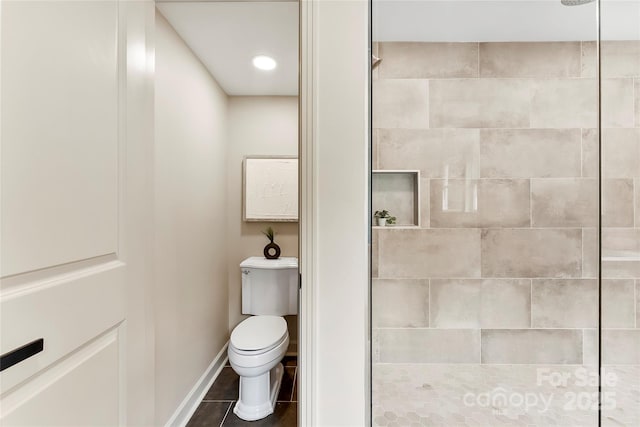 3661 Annlin Ave, Charlotte, NC 28209 - bathroom featuring a tile shower, toilet, baseboards, and tile patterned flooring