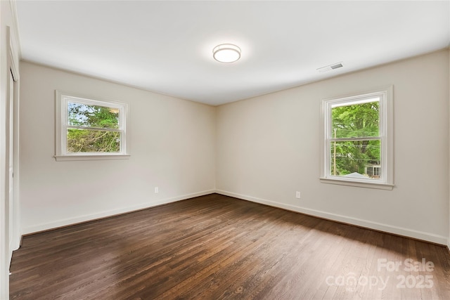 3661 Annlin Ave, Charlotte, NC 28209 - empty room featuring plenty of natural light, wood finished floors, and baseboards