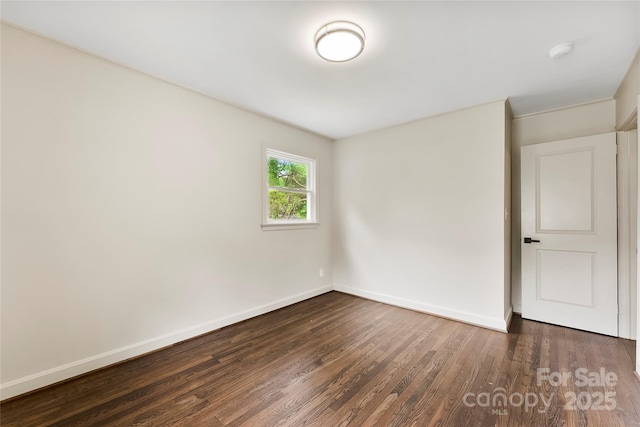 3661 Annlin Ave, Charlotte, NC 28209 - unfurnished room with baseboards, dark wood finished floors, and a smoke detector