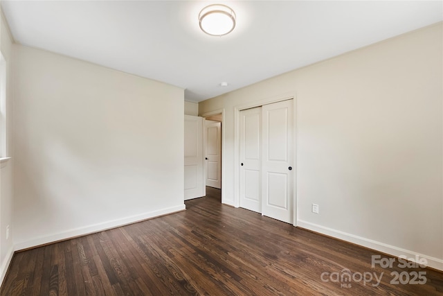 3661 Annlin Ave, Charlotte, NC 28209 - unfurnished bedroom with dark wood finished floors, baseboards, and a closet