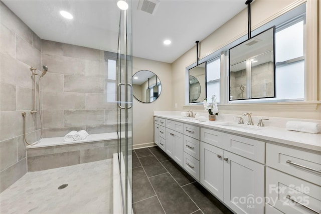 3661 Annlin Ave, Charlotte, NC 28209 - full bathroom featuring a stall shower, healthy amount of natural light, double vanity, tile patterned flooring, and recessed lighting