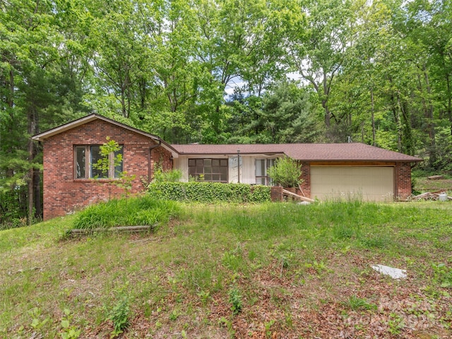 3 N Marley Dr, Flat Rock, NC 28731 - view of front of property with an attached garage and brick siding