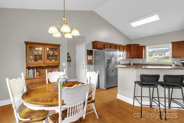 170 Wagon Wheel Way Unit 4, Salisbury, NC 28147 - dining area with a chandelier, light wood-type flooring, and high vaulted ceiling