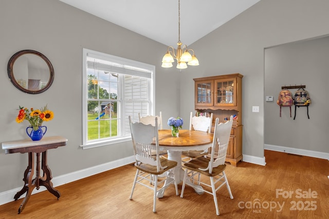 170 Wagon Wheel Way Unit 4, Salisbury, NC 28147 - dining room featuring light wood-style flooring, a chandelier, baseboards, and lofted ceiling