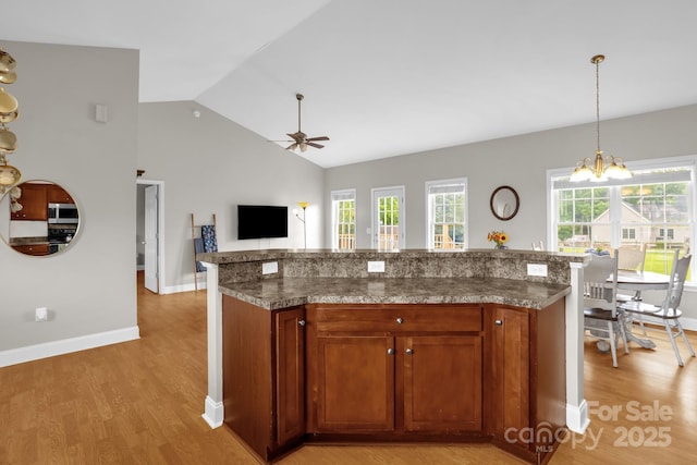 170 Wagon Wheel Way Unit 4, Salisbury, NC 28147 - kitchen with stainless steel microwave, ceiling fan, light wood-style flooring, baseboards, and high vaulted ceiling