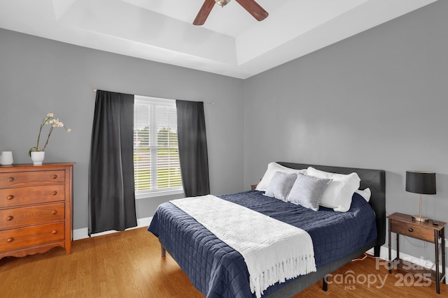 170 Wagon Wheel Way Unit 4, Salisbury, NC 28147 - bedroom featuring a tray ceiling, wood finished floors, baseboards, and a ceiling fan