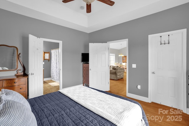 170 Wagon Wheel Way Unit 4, Salisbury, NC 28147 - bedroom with wood finished floors, baseboards, a ceiling fan, and connected bathroom