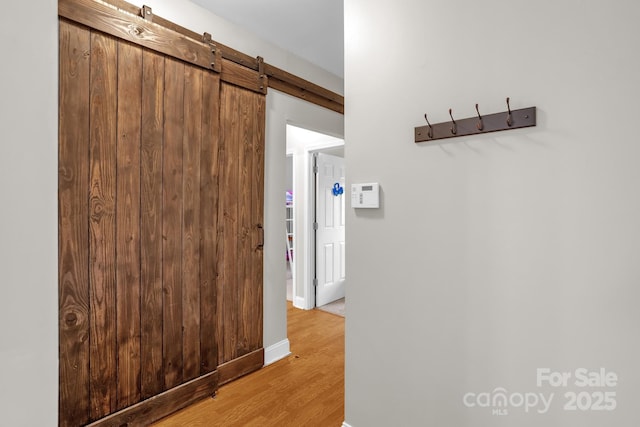 170 Wagon Wheel Way Unit 4, Salisbury, NC 28147 - hall featuring light wood-style flooring and a barn door