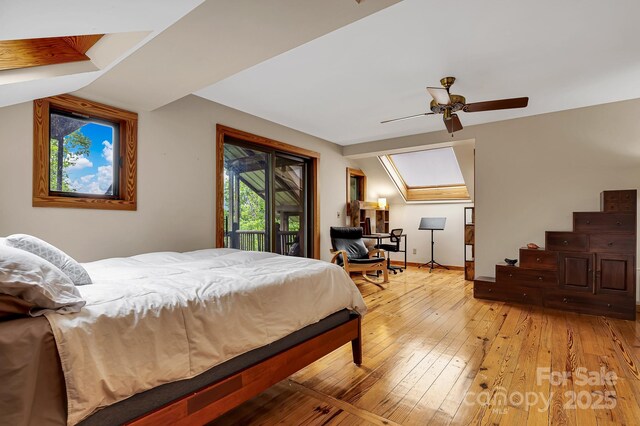 214 Laurel Mountain Trl, Saluda, NC 28773 - bedroom with light wood-style floors, lofted ceiling, access to exterior, ceiling fan, and baseboards