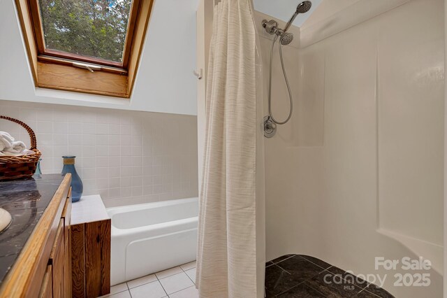 214 Laurel Mountain Trl, Saluda, NC 28773 - bathroom with a shower with shower curtain, tile patterned flooring, vanity, a bathtub, and tile walls