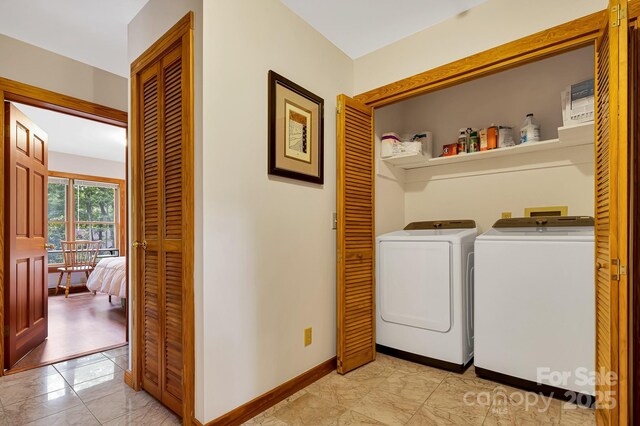 214 Laurel Mountain Trl, Saluda, NC 28773 - laundry area featuring separate washer and dryer, baseboards, and light marble finish flooring