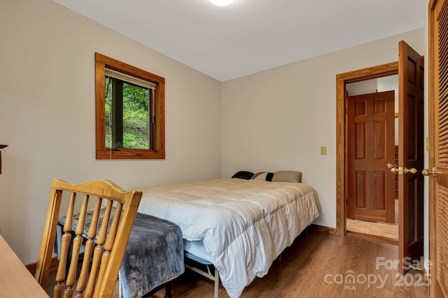 214 Laurel Mountain Trl, Saluda, NC 28773 - bedroom with wood finished floors