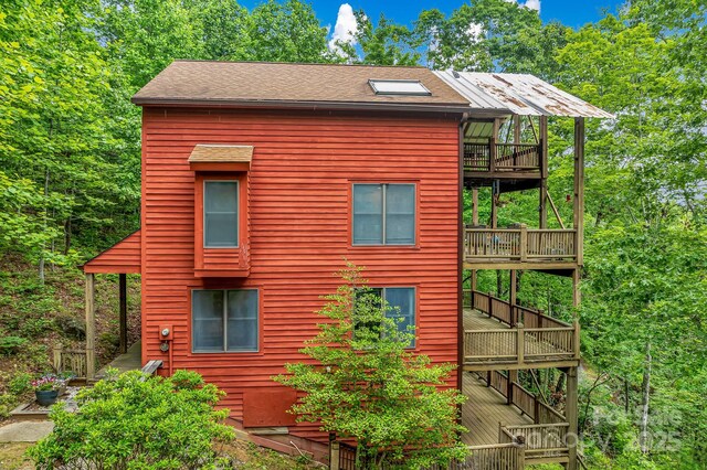 214 Laurel Mountain Trl, Saluda, NC 28773 - view of side of property with a wooden deck, roof with shingles, and stairs