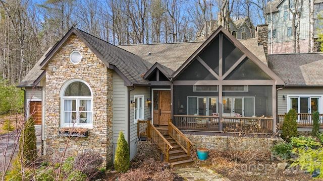 140 Lost Trl Unit 145, Highlands, NC 28741 - view of front of home featuring stone siding, french doors, a chimney, and roof with shingles