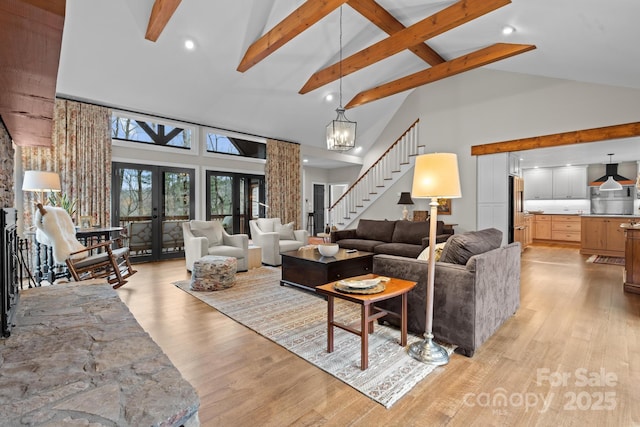 140 Lost Trl Unit 145, Highlands, NC 28741 - living room with high vaulted ceiling, light wood-style flooring, beamed ceiling, stairway, and recessed lighting
