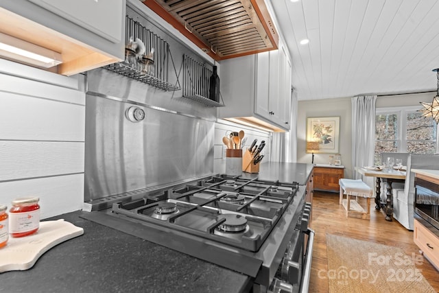 140 Lost Trl Unit 145, Highlands, NC 28741 - kitchen featuring cooktop, recessed lighting, white cabinets, light wood-type flooring, and ventilation hood