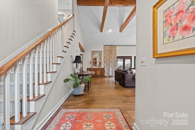 140 Lost Trl Unit 145, Highlands, NC 28741 - entryway with high vaulted ceiling, wood finished floors, beam ceiling, baseboards, and stairway