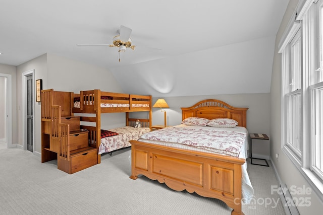140 Lost Trl Unit 145, Highlands, NC 28741 - bedroom with light colored carpet, lofted ceiling, baseboards, and ceiling fan