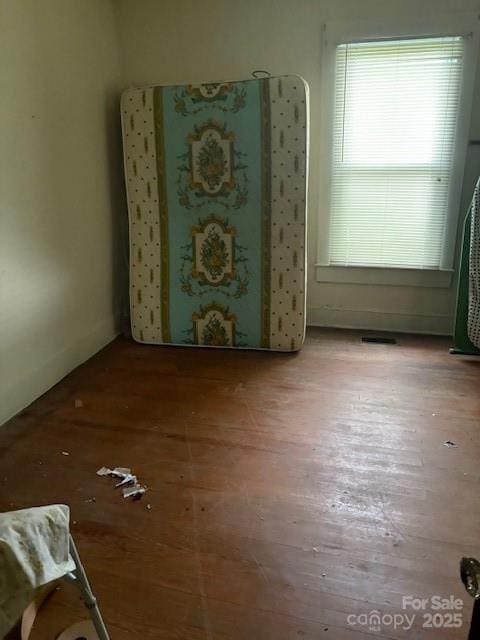 unfurnished room featuring wood finished floors