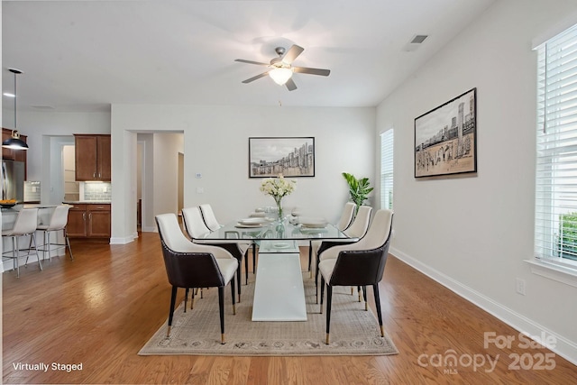 467 Granite Lake Ct, Denver, NC 28037 - dining room with ceiling fan, wood finished floors, and baseboards