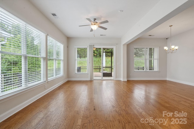 467 Granite Lake Ct, Denver, NC 28037 - empty room with a ceiling fan, plenty of natural light, a chandelier, and baseboards